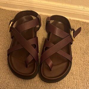 A. Emery Elbert Cross-Strap Sandals in Deep bugundy with Gold Buckle
